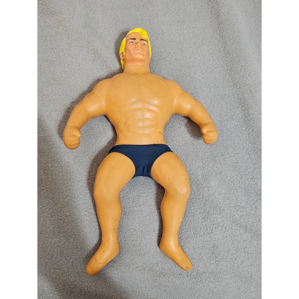 Hasbro Stretch Armstrong action figure featuring his blond hair and blue trunks